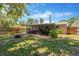 Large backyard showcasing mature trees and a screened lanai, ideal for serene outdoor living at 1726 York S St, Gulfport, FL 33707