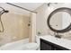 Cozy bathroom featuring tiled walls, shower, and vanity, creating a clean and functional space at 1726 York S St, Gulfport, FL 33707