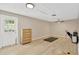 Versatile bonus room with durable laminate floors, neutral walls, and a ceiling fan at 1726 York S St, Gulfport, FL 33707
