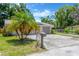 Charming single-story home with a well-maintained lawn, palm tree, and a paved driveway at 1726 York S St, Gulfport, FL 33707
