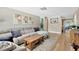 Inviting living room with a plush sofa, wood floors, and stylish decor, perfect for relaxing at 1726 York S St, Gulfport, FL 33707