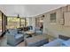 Comfortable screened-in patio with ceiling fan, wicker furniture, and view of the backyard at 1726 York S St, Gulfport, FL 33707