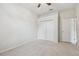 Bedroom featuring carpet, a window, a ceiling fan and a double door closet at 19106 Beckett Dr, Odessa, FL 33556