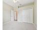 Bedroom featuring neutral walls, carpet flooring, ceiling fan, and a closet at 19106 Beckett Dr, Odessa, FL 33556