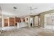 Bright open-concept living space featuring wood tile flooring, with kitchen, dining area, and other rooms visible at 19106 Beckett Dr, Odessa, FL 33556