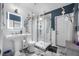Beautiful bathroom with a glass shower, marble floors, pedestal sink and lovely lighting at 19620 Eagle Crest Dr, Lutz, FL 33549