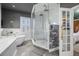 Contemporary bathroom showcasing a glass shower, bathtub, and sleek design at 19620 Eagle Crest Dr, Lutz, FL 33549