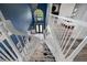 View from top of stairs of grand foyer featuring soaring ceilings and ornate decor at 19620 Eagle Crest Dr, Lutz, FL 33549