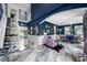 Staircase leading to an open floor plan featuring elegant seating, dining, and decor at 19620 Eagle Crest Dr, Lutz, FL 33549