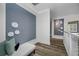 Well-lit hallway with hardwood flooring, modern decor and a calming color scheme at 19620 Eagle Crest Dr, Lutz, FL 33549