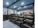 Home theater featuring comfortable seating, a projector, and a refreshment area with snack and beverage amenities at 19620 Eagle Crest Dr, Lutz, FL 33549