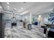 Modern, gray kitchen open to bright living area, complete with island and stainless appliances at 19620 Eagle Crest Dr, Lutz, FL 33549