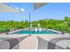 Inviting backyard pool area with lounge chairs, a gazebo, mature landscaping, and clear blue water at 19620 Eagle Crest Dr, Lutz, FL 33549