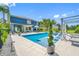 A luxury pool with a relaxing poolside lounge area, ideal for entertaining and soaking up the sun at 19620 Eagle Crest Dr, Lutz, FL 33549