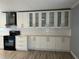 Contemporary kitchen with modern cabinets, sleek appliances, a stylish range hood, and tile backsplash at 2278 Republic Dr, Dunedin, FL 34698