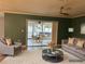 Inviting living room with plush seating and view to the patio's outdoor dining and spa at 2278 Republic Dr, Dunedin, FL 34698