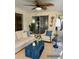 Cozy patio features comfortable seating with stylish blue accents, ideal for enjoying outdoor living at 2278 Republic Dr, Dunedin, FL 34698
