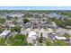 Aerial view displays home and landscaping within a neighborhood near a waterway at 2306 W Ivy St, Tampa, FL 33607