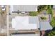Aerial view of the property with the white roof in the center of the frame at 2306 W Ivy St, Tampa, FL 33607