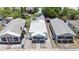 Aerial view of the home showing the roof, surrounding houses, and symmetrical front yard at 2306 W Ivy St, Tampa, FL 33607