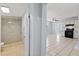 The bathroom has modern tiling, a walk-in shower, with an open concept into the kitchen area at 2306 W Ivy St, Tampa, FL 33607