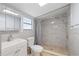 Updated bathroom with modern fixtures and a walk-in shower at 2306 W Ivy St, Tampa, FL 33607