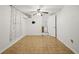 View of the bedroom with tile floors and a glimpse into the adjoining kitchen area at 2306 W Ivy St, Tampa, FL 33607