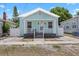 Charming bungalow with light blue exterior, white trim, and inviting front porch at 2306 W Ivy St, Tampa, FL 33607