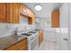 Efficient kitchen featuring granite countertops, white cabinets, and modern appliances, making cooking a pleasure at 2306 W Ivy St, Tampa, FL 33607