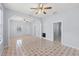 Open living room featuring tile floors, white trim, and a ceiling fan at 2306 W Ivy St, Tampa, FL 33607