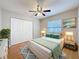 Bright bedroom with large closet, cozy bed, and ample natural light from the window at 2707 Lakeville Dr, Tampa, FL 33618