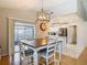 Dining area with views of the kitchen and outdoor patio through sliding glass doors at 2707 Lakeville Dr, Tampa, FL 33618