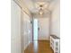 Inviting entryway featuring wood floors and decorative lighting fixture at 2707 Lakeville Dr, Tampa, FL 33618