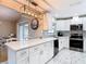 Well-lit kitchen featuring white cabinets, modern appliances, and stylish marble tile flooring at 2707 Lakeville Dr, Tampa, FL 33618