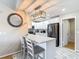 Stylish kitchen with white cabinets, stainless steel appliances, and marble-patterned flooring at 2707 Lakeville Dr, Tampa, FL 33618