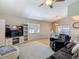 Bright living room with vaulted ceiling, and sliding doors to outside at 2707 Lakeville Dr, Tampa, FL 33618