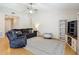 Cozy living room features hardwood floors and neutral paint colors at 2707 Lakeville Dr, Tampa, FL 33618