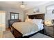 Cozy bedroom with wood accents, featuring a comfortable bed and dresser at 2707 Lakeville Dr, Tampa, FL 33618