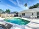 Beautiful backyard pool with sitting area great for entertaining and relaxation at 2707 Lakeville Dr, Tampa, FL 33618