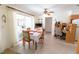 Bright dining area with tile flooring, backyard access, and a built-in workspace at 2854 60Th N St, St Petersburg, FL 33710