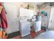 The laundry room has a utility sink, washer and dryer, as well as plenty of cabinet space at 2854 60Th N St, St Petersburg, FL 33710