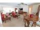 Open-concept living and dining area with ample seating and a large dining table at 2854 60Th N St, St Petersburg, FL 33710
