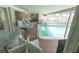 Enclosed pool area with lounge chairs for relaxing by the pool at 2854 60Th S St, St Petersburg, FL 33710