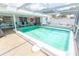 Enjoy the Florida weather with this screened-in pool and patio area, perfect for entertaining and relaxation at 2854 60Th N St, St Petersburg, FL 33710