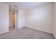 A bright bedroom with a closet door, offering a comfortable space for rest and storage at 2882 Peony Prairie Ln, Wesley Chapel, FL 33543
