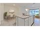Bright kitchen with stainless steel appliances and granite countertops open to dining area at 2882 Peony Prairie Ln, Wesley Chapel, FL 33543