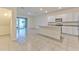 Open-concept kitchen with an island, stainless steel appliances, and tile flooring at 2882 Peony Prairie Ln, Wesley Chapel, FL 33543