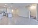 Open-concept living room featuring tile flooring, recessed lighting, and staircase at 2882 Peony Prairie Ln, Wesley Chapel, FL 33543