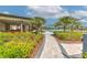 Community pool with ample seating, lush landscaping, and covered areas for residents to enjoy at 2882 Peony Prairie Ln, Wesley Chapel, FL 33543