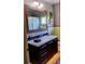 Bathroom featuring an oversized mirror, neutral color palette, modern vanity, and a dark wood finish at 307 Druid Hills Rd, Temple Terrace, FL 33617